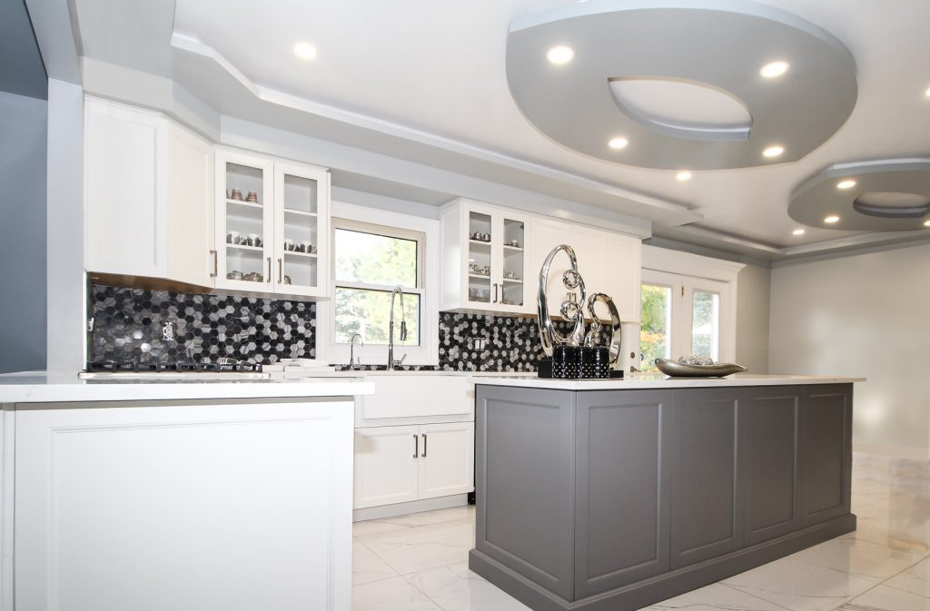 White neo-traditional kitchen with grey island and accents