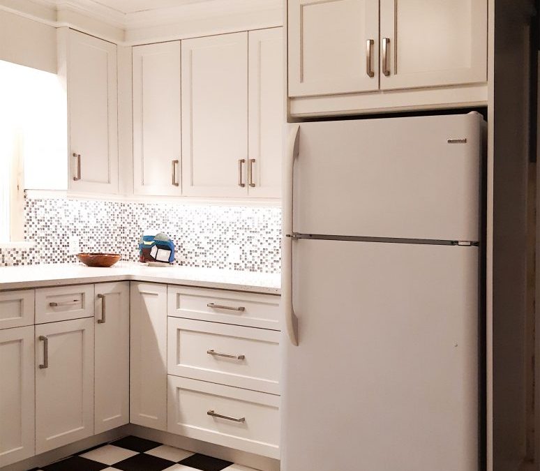 Same footprint with new cabinets over fridge and stove