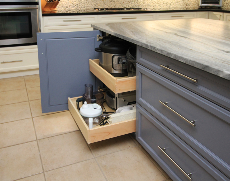 One of 4 island drawer banks is sized for appliance storage