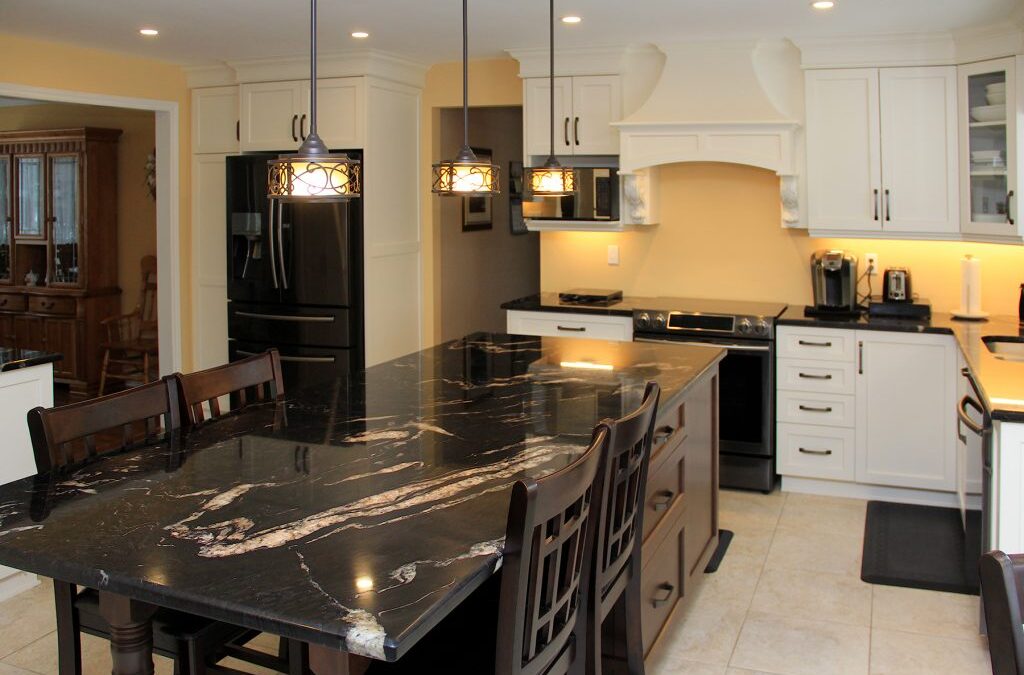 Traditional white cabinets with contrasting dark maple island