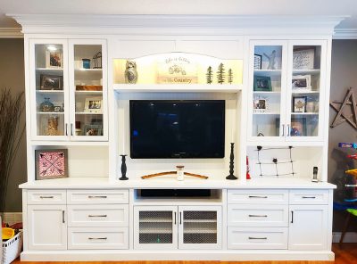 photo of white TV entertainment and bookcase wall unit