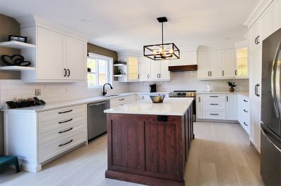 White kitchen with dark red oak island - view from right angle