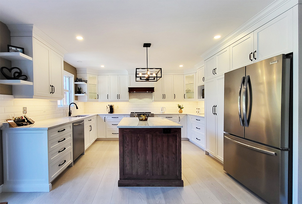 White U-shped kitchen with dark red oak island and white countertops and backsplash